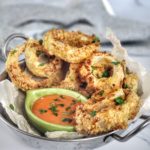 Crispy, crunchy and quick, these baked onion rings are lower in carbs thanks to a coating that includes keto-friendly ingredients like crushed pork rinds, Parmesan cheese and coconut flour. A delicious appetizer, game day snack or side dish for steak, burgers and more!