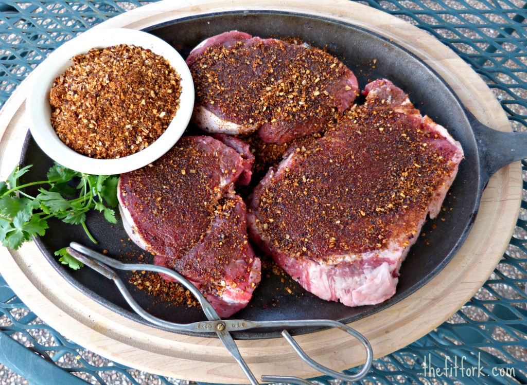 Steaks ready to hit the grill, rubbed with flavorful spices.
