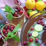 Citrus Cranberry Tea with Holiday Ice Ring is a festive addition to your holiday celebration. A non alcoholic libation that's suitable for the entire family. Three ingredient punch an super easy to make ice ring with lemonade, ginger ale, lemons, limes, cranberries and mint.