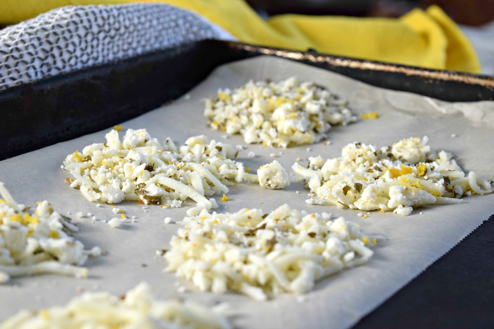 lemon feta cheese crisps on baking sheet uncooked