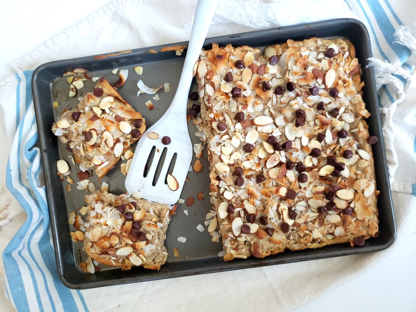 Almond Joy Sheet Pan Pancake - gluten free, vegan, no added sugar. Great for meal prep and make-ahead breakfast for a large group.