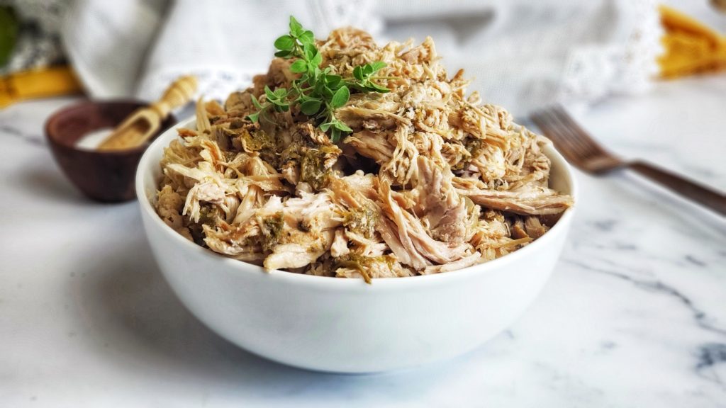 Hatch Green Chile Pulled Pork in Slow cooker -- easy and versatile! Great for tacos, enchiladas, soups and to meal prep and stock pile in the freezer.