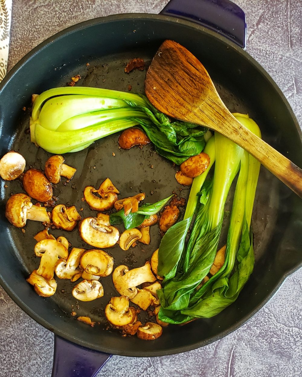 Saute mushrooms and bok choy as the final step