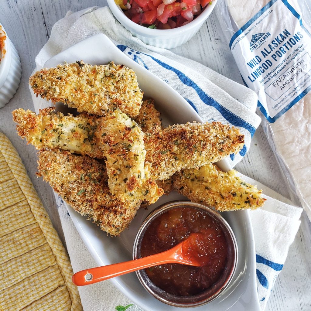 Crispy fish sticks are a family favorite and this easy fish dinner is made with lingcod, cold, pollock, halibut or other firm white fish and served with a simple three ingredient sauce. Paleo friendly, low carb and gluten-free -- perfect for Lent and also busy week night meals as only 25 minutes prep to  plate.