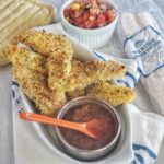 Crispy fish sticks are a family favorite and this easy fish dinner is made with lingcod, cold, pollock, halibut or other firm white fish and served with a simple three ingredient sauce. Paleo friendly, low carb and gluten-free -- perfect for Lent and also busy week night meals as only 25 minutes prep to plate.