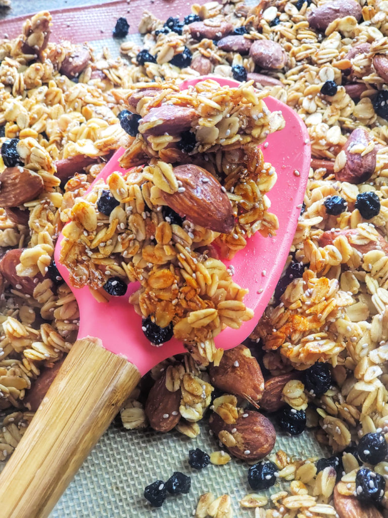 Crunch, lightly sweet and wholesomely satisfying for breakfast or a snack, this easy homemade granola recipe features oats, dried blueberries and almonds -- and also sugar swaps and collagen powder to keep the carbs lowered and protein up!