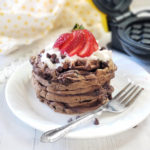 Power into the day fueled by chocolatey waffles made with protein powder. Only takes minutes to make, is gluten-free, has no added sugar, and moderate in carbs. A single-serve recipe, but simple to scale up for meal prep. Enjoy 28 grams of protein per serving!