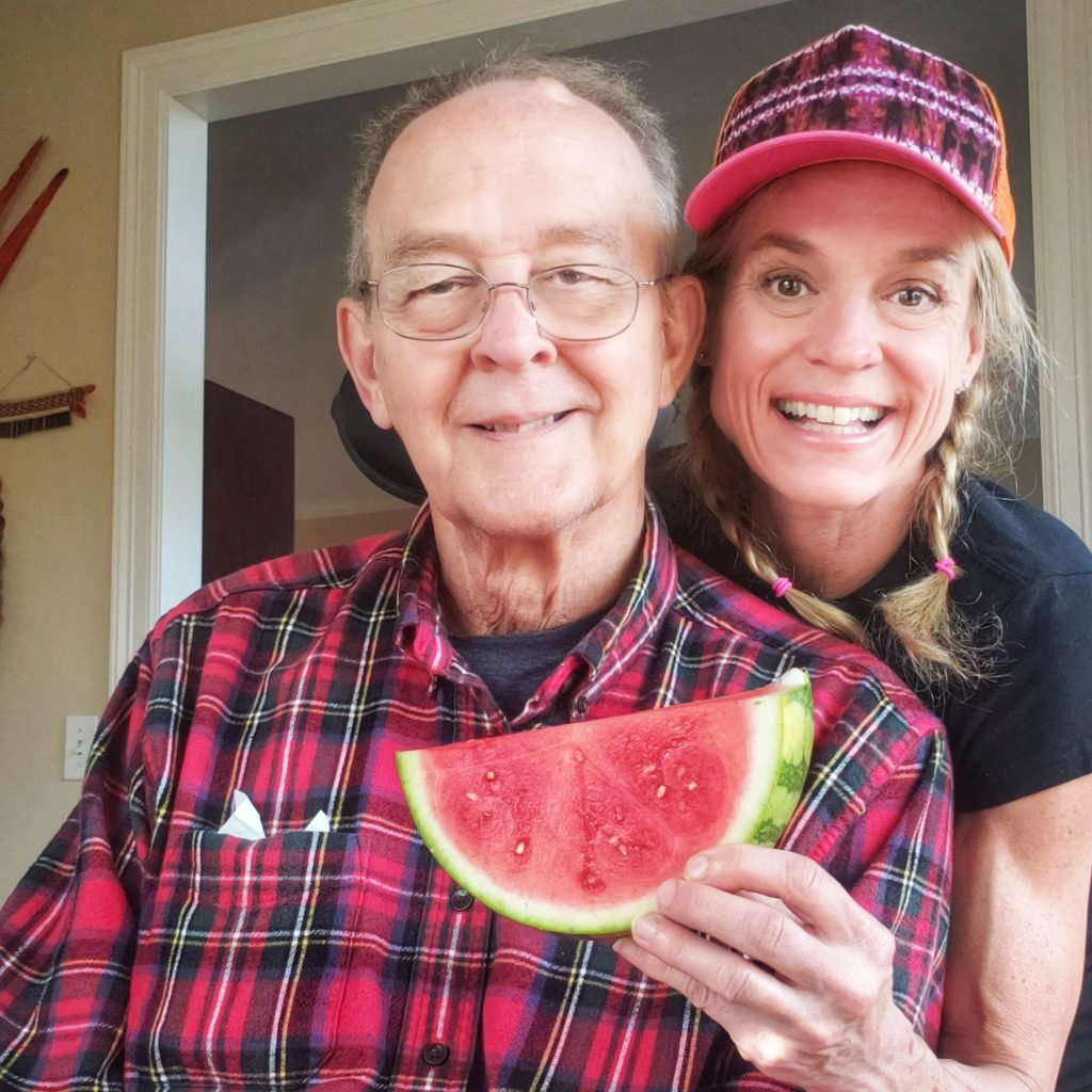 senior man father and adult woman daughter enjoying watermelon thefitfork.com