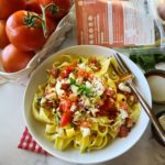 Whip up a fresh fit meal in minutes with this easy, no-cook pasta sauce that features tomatoes, marinated artichokes, garlic and feta cheese - plus a little EVOO. It's tossed with hot noodles that warms it up! A delicious summer dinner! Used pasta from the Wildgrain subscription box, save $30 with code THEFITFORK at http://bit.ly/Wildgrain