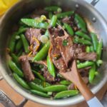 Vibrant and citrus-y, this lightly spicy-sweet orange beef stir-fry made with steak is sure to please on busy nights! It comes together in just 15 minutes, lots of veggie goodness with the sugar snap peas, and 100% beats going for takeout!
