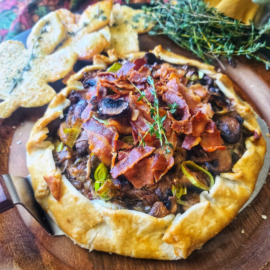 So bold and beautiful, this mushroom blue cheese tart is filled with flavor and easy to make thanks to a frozen pie crust! Sever with a green salad for a brunch or light dinner -- or as an appetizer for your fall-season party!