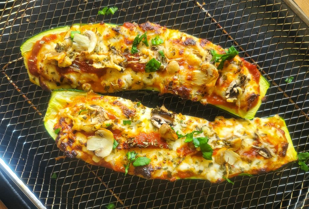 Quick, easy, delicious and nutritious, these cheesy, saucy stuffed zucchini boats will remind you of a mushroom pizza - -but without the crust, so lower calorie, lower carb and gluten-free. A great way to use up a bumper crop of squash!