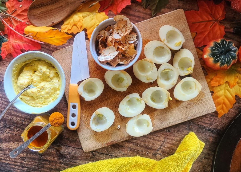 These clever deviled eggs look like little autumn pumpkins, but contain no squash – only eggs, Dijon mustard, salt, pepper and turmeric for the signature orange hue of the season.  Low in calories, high in protein – a smart snack for Halloween, Thanksgiving or any fall festival.  