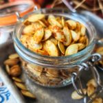 Garlicky Roasted Pumpkin Seeds can be made in the air-fryer or oven and are a quick, easy and economical snack you will love this fall season.