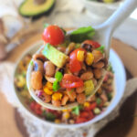 Black-eyed Pea Texas Caviar brings together bold flavors, wholesome ingredients, and a sprinkle of good fortune. This vibrant mix of black-eyed peas, roasted corn, juicy tomatoes, creamy avocado, crisp red onion, and fresh cilantro, all tossed in a zippy lime vinaigrette, has been a New Year’s Day tradition for as long as I can remember—those lucky black-eyed peas are said to bring prosperity, but the rich flavors alone make us feel like we’re starting the year off right. Beyond the holiday, Texas Caviar shines year-round as a versatile side for cookouts, a topping for salads, or a crowd-pleasing dip for game-day gatherings. Fresh, zesty, and undeniably Texan, it’s a dish that’s as nourishing as it is delicious and one you’ll want to make on repeat.