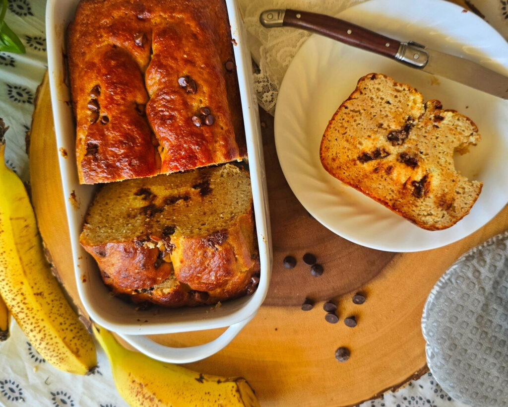 This Chocolate Chip Cookie Dough Protein Banana Bread is packed with 20g protein per serving, no added sugar, and chocolate chip cookie dough swirls. Perfect for breakfast, snacks, or dessert.