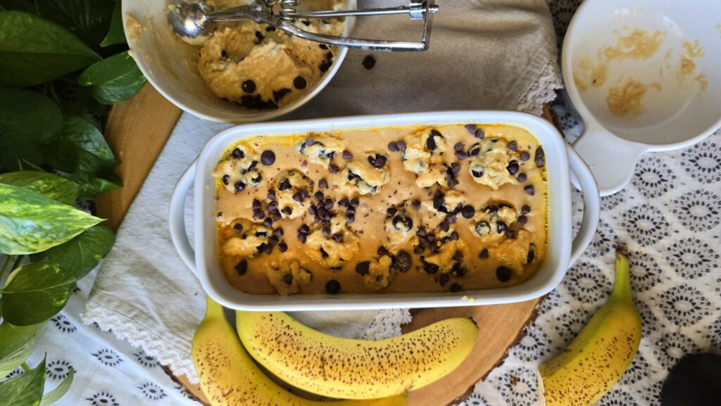 This Chocolate Chip Cookie Dough Protein Banana Bread is packed with 20g protein per serving, no added sugar, and chocolate chip cookie dough swirls. Perfect for breakfast, snacks, or dessert.