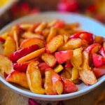Enjoy warm, cinnamon-dusted, maple syrup glazed air fryer apples — a healthy, gluten-free dessert that tastes like apple pie without the crust. Quick, easy, and made with no refined sugar!