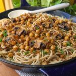 Creamy caramelized onion and mushroom pasta with chickpeas made with a lighter, high-protein cottage cheese Alfredo sauce. This vegetarian comfort food delivers big flavor with just 335 calories and 20g protein per serving.