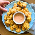 Crispy Air Fryer Fish Nuggets made with Alaskan pollock, a crunchy cracker-Parmesan coating, and a healthier Greek yogurt special sauce. Ready in just 15 minutes for an easy family dinner.
