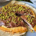 Inspired by the Dubai chocolate trend, this no-added-sugar Chocolate Pistachio Date Tart combines dates, cinnamon, pistachios, and sugar-free dark chocolate inside convenient Wick's pie dough circles for an easy dessert with baklava vibes.